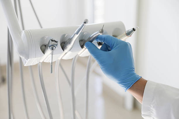 Professional Tooth Extraction technician working in Peach County County, GA